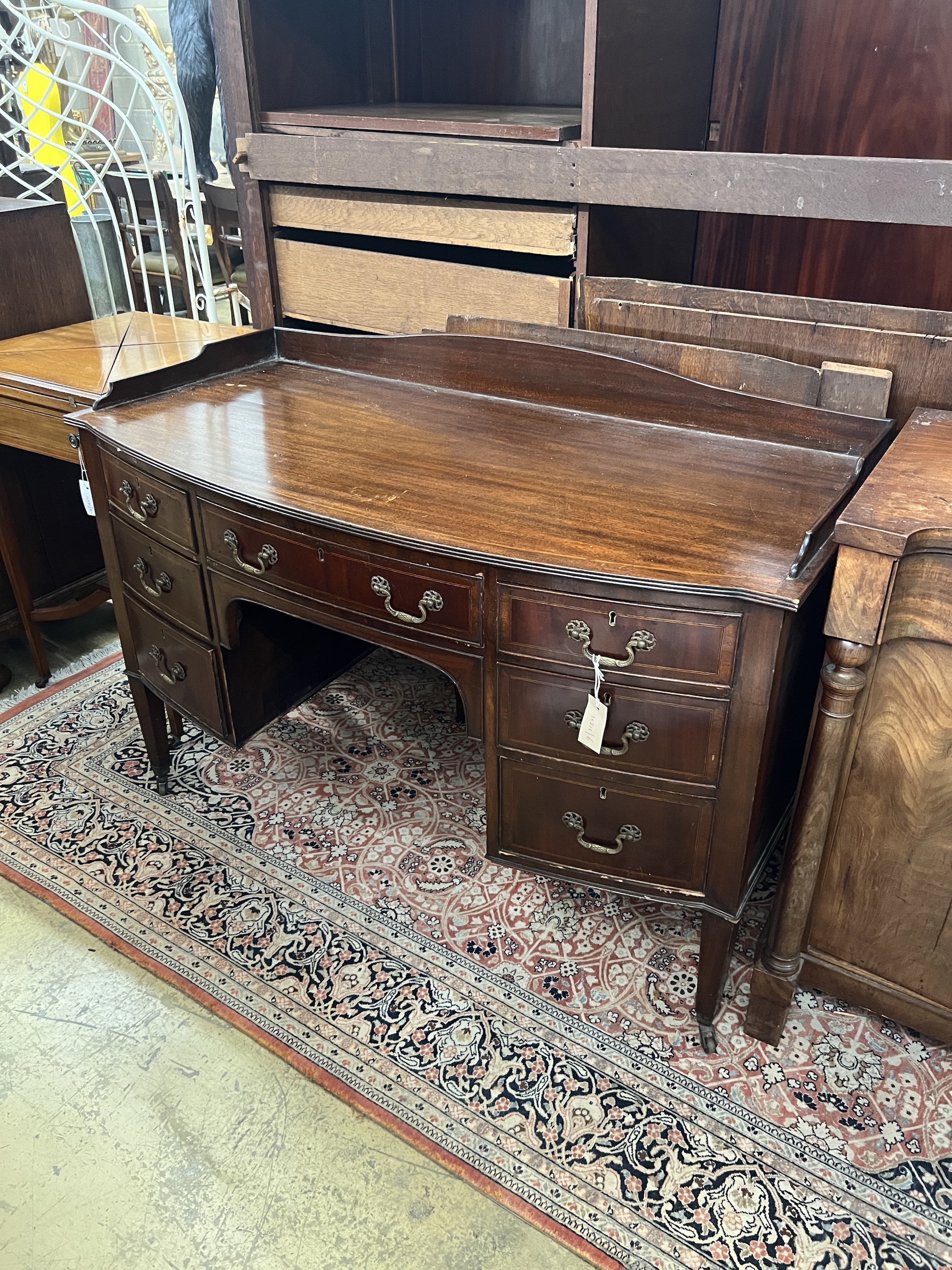 An Edwardian mahogany bow front kneehole washstand, width 122cm, depth 58cm, height 86cm